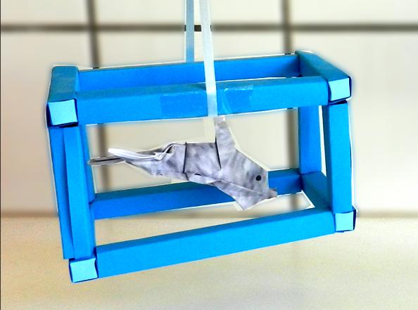 Origami Dolphin in a paper aquarium