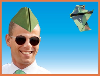 man wearing an origami cadet cap
