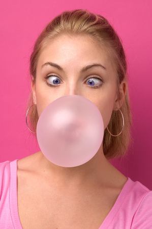 Girl blowing chewing gum