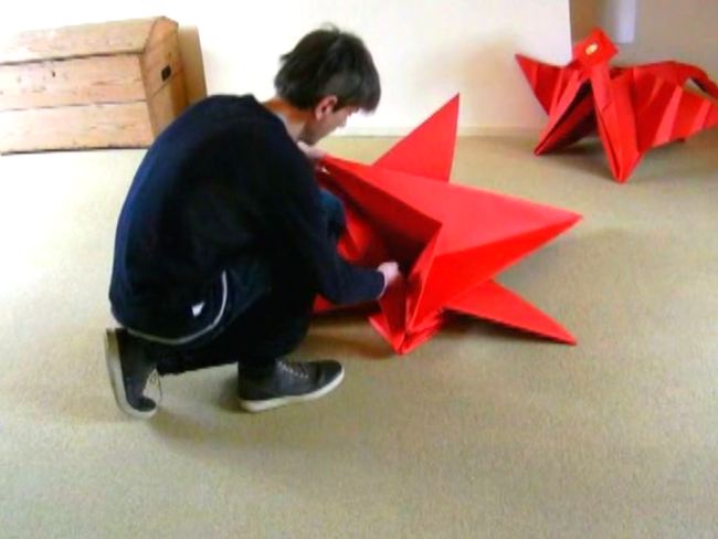 Folding a large Origami Dragon