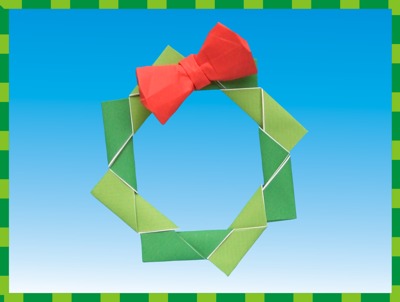 modular origami christmas wreath with a red bow on it modular origami christmas wreath with a red bow on it