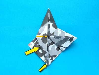 folding an origami plane - stunt fighter