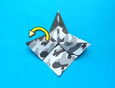 folding an origami plane - stunt fighter