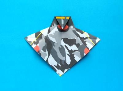 folding an origami plane - stunt fighter