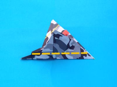 folding an origami plane - stunt fighter