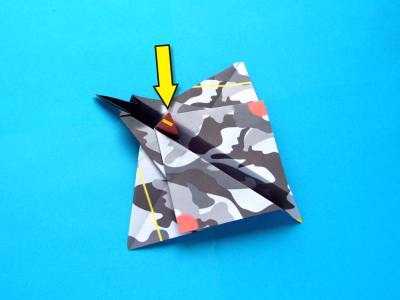 folding an origami plane - stunt fighter