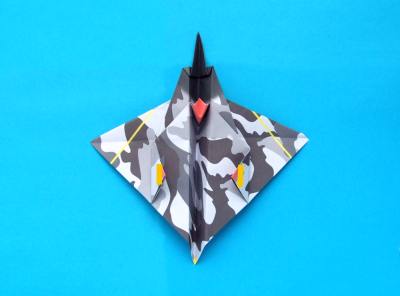 folding an origami plane - stunt fighter