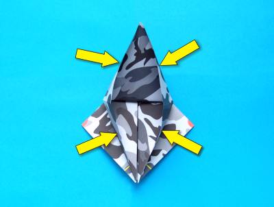 folding an origami plane - stunt fighter