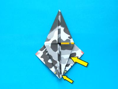 folding an origami plane - stunt fighter