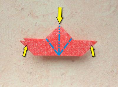 red origami flower with a yellow center red origami flower with a yellow center