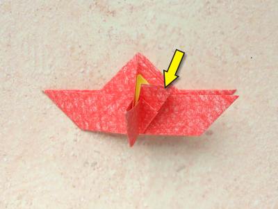red origami flower with a yellow center red origami flower with a yellow center