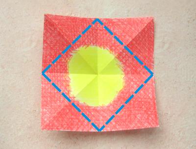 red origami flower with a yellow center red origami flower with a yellow center