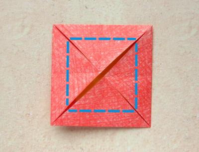 red origami flower with a yellow center red origami flower with a yellow center