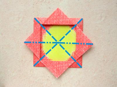 red origami flower with a yellow center red origami flower with a yellow center