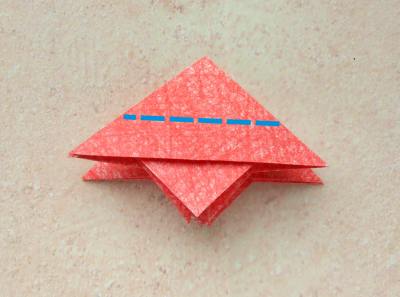 red origami flower with a yellow center red origami flower with a yellow center