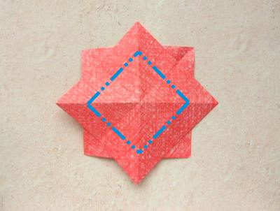 red origami flower with a yellow center red origami flower with a yellow center