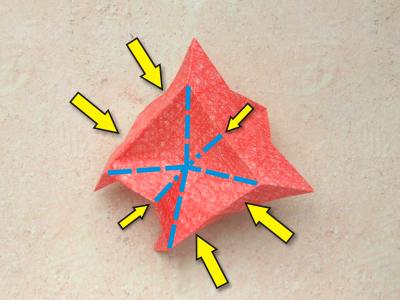 red origami flower with a yellow center red origami flower with a yellow center