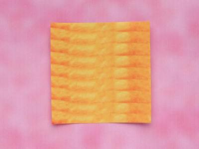yellow piece of paper for making a simple origami flower yellow piece of paper for making a simple origami flower