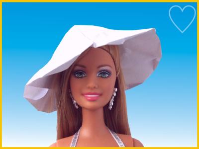 barbie doll wearing an origami summer hat