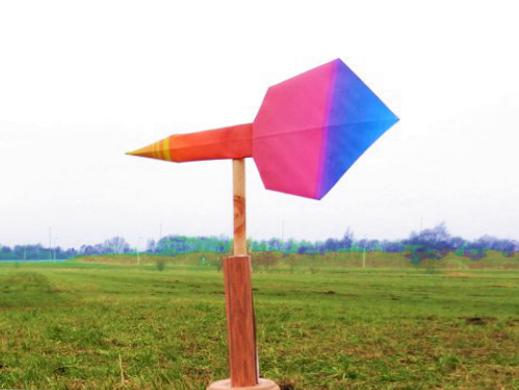 windwijzer van papier in de Nederlandse polder