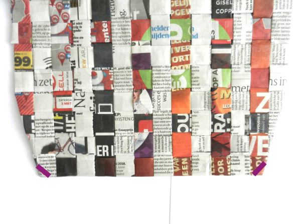 Make a woven newspaper clutch purse