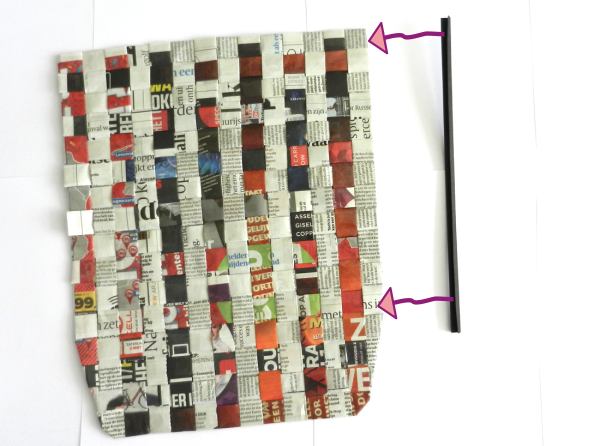 Make a woven newspaper clutch purse