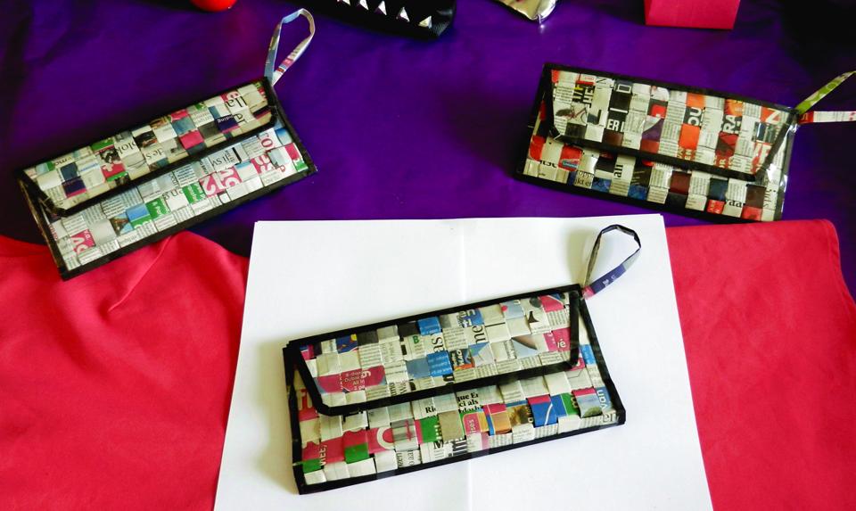 Woven newspaper clutch purses