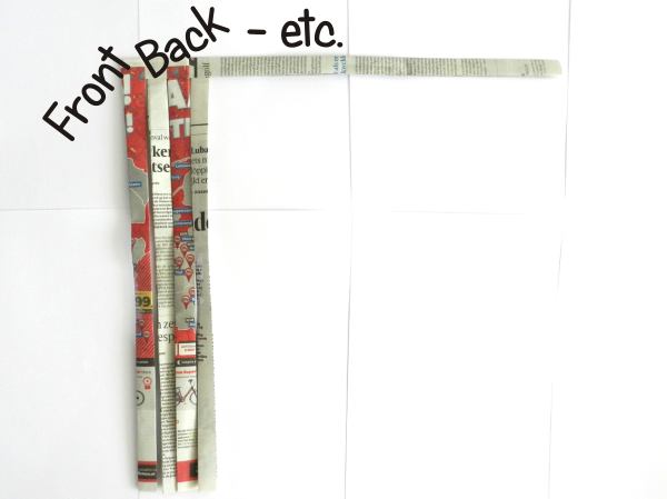 Make a woven newspaper clutch purse