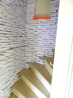 narrow alley made with hundreds of origami bricks