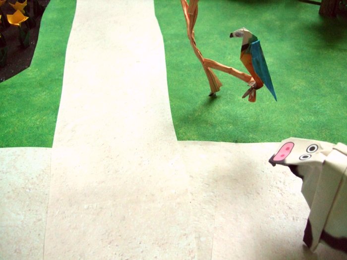 cow talking to an origami parrot cow talking to an origami parrot