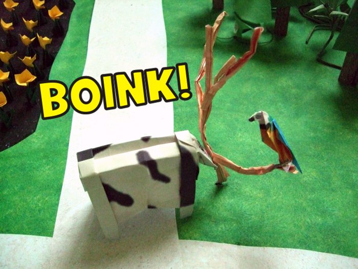 origami cow running against a paper tree origami cow running against a paper tree
