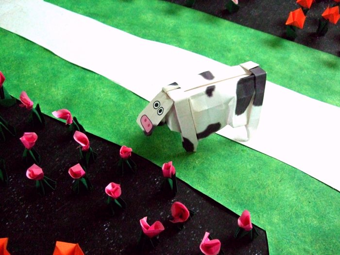 origami cow looking at cute paper flowers origami cow looking at cute paper flowers