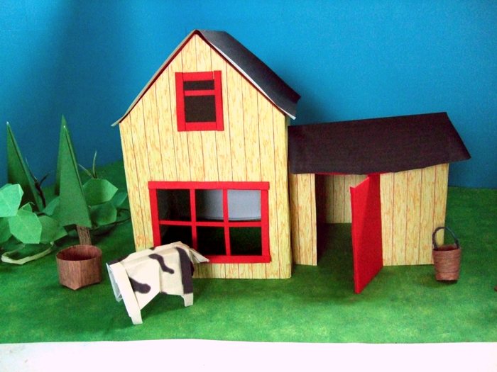 cow looking through the window of a paper house cow looking through the window of a paper house