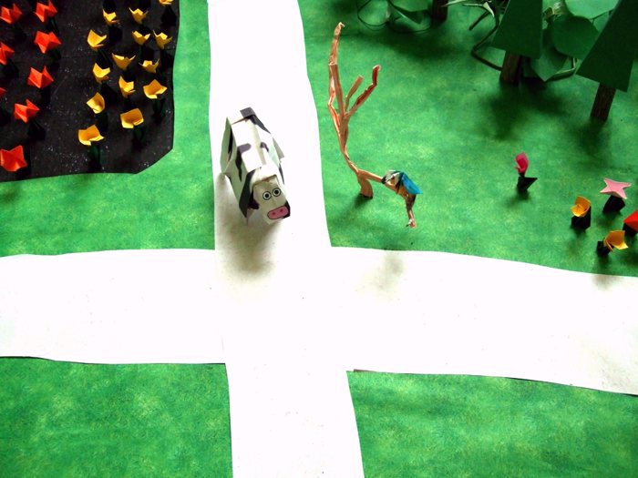 origami cow walking on a cross road origami cow walking on a cross road