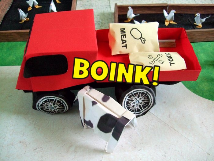 origami cow running against a paper pick up truck origami cow running against a paper pick up truck