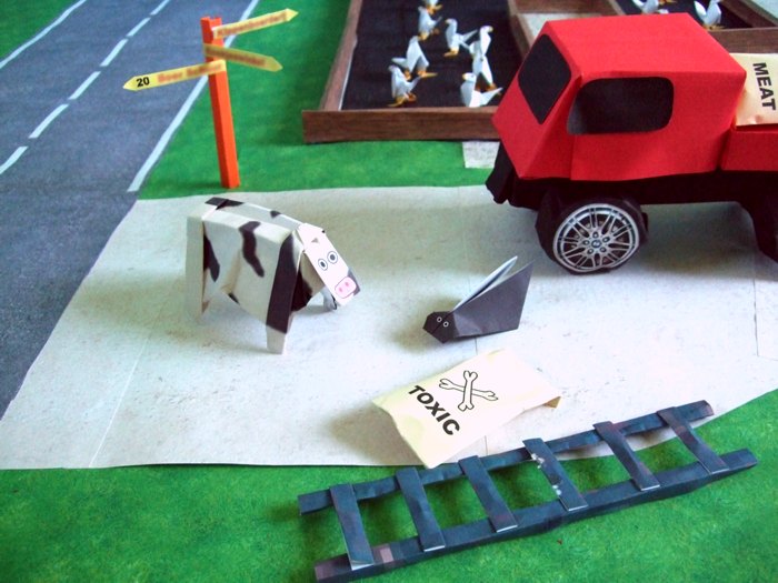 origami cow talking to a bug origami cow talking to a bug
