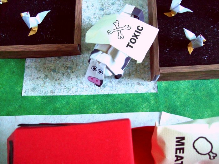 origami cow at a large chicken farm origami cow at a large chicken farm