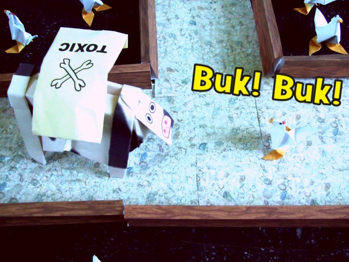 origami chicken standing in front of a cow origami chicken standing in front of a cow