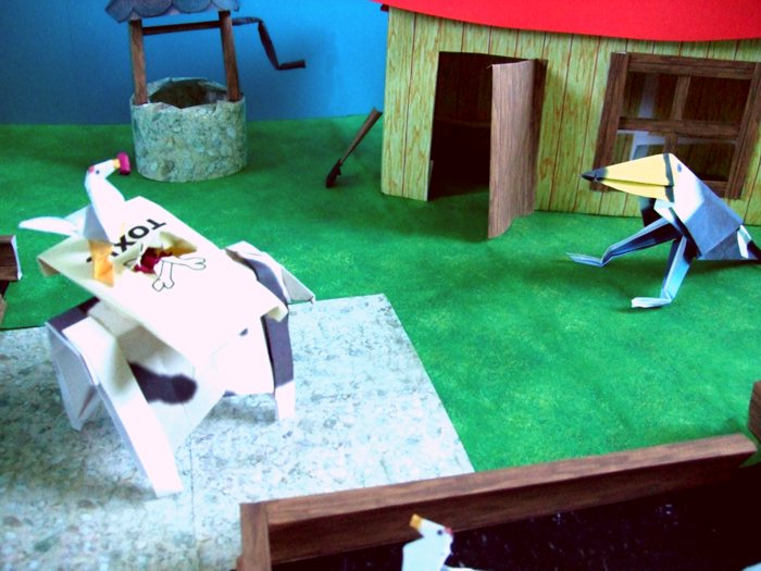 origami cow visiting a chicken farmer