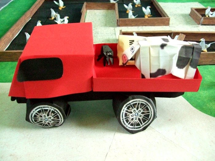 cow standing on a kirigami pick up truck cow standing on a kirigami pick up truck
