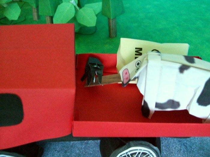 origami cow trying to get rid of a large spider origami cow trying to get rid of a large spider