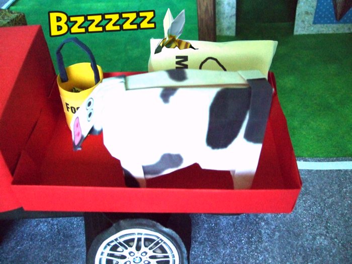 origami wasp flying above a cow origami wasp flying above a cow