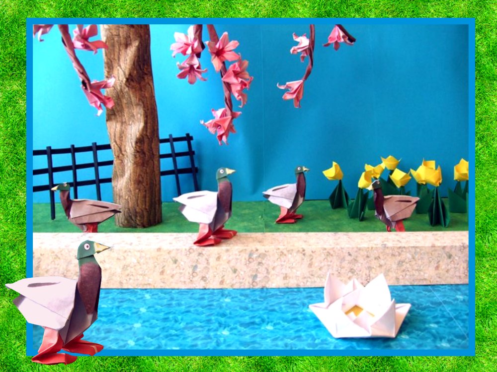 card with origami ducks in the park