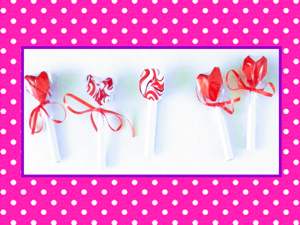 Lollies op een roze polka dot achtergrond Lollies op een roze polka dot achtergrond