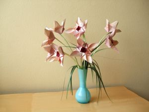 Card with pink origami flowers in a blue vase