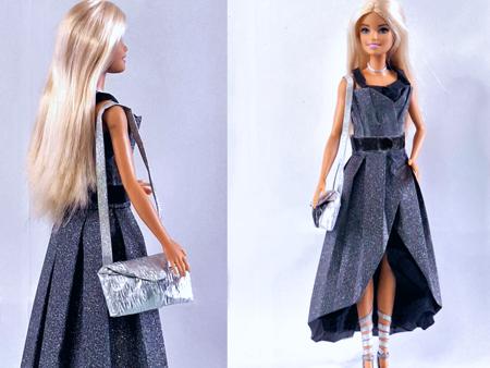 Barbie doll in a paper party dress
