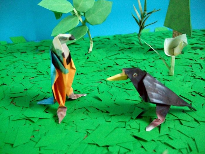 origami papegaai en een leuke merel origami papegaai en een leuke merel