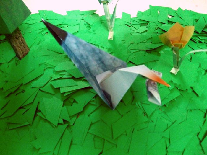 origami gull eating a nice fish origami gull eating a nice fish