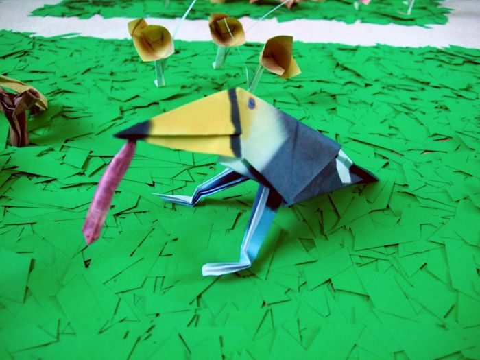 funny origami bird with a large worm in his mouth funny origami bird with a large worm in his mouth