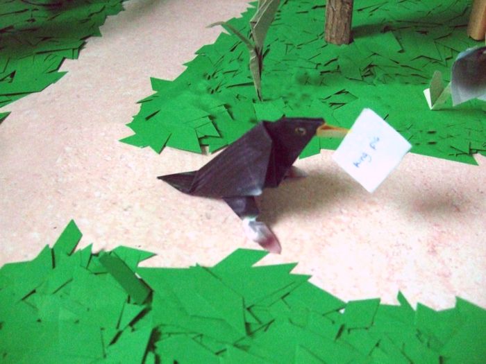 origami birdie walking on a path in the forest origami birdie walking on a path in the forest